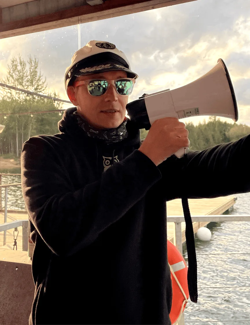 A photo of Jaanus holding a megaphone